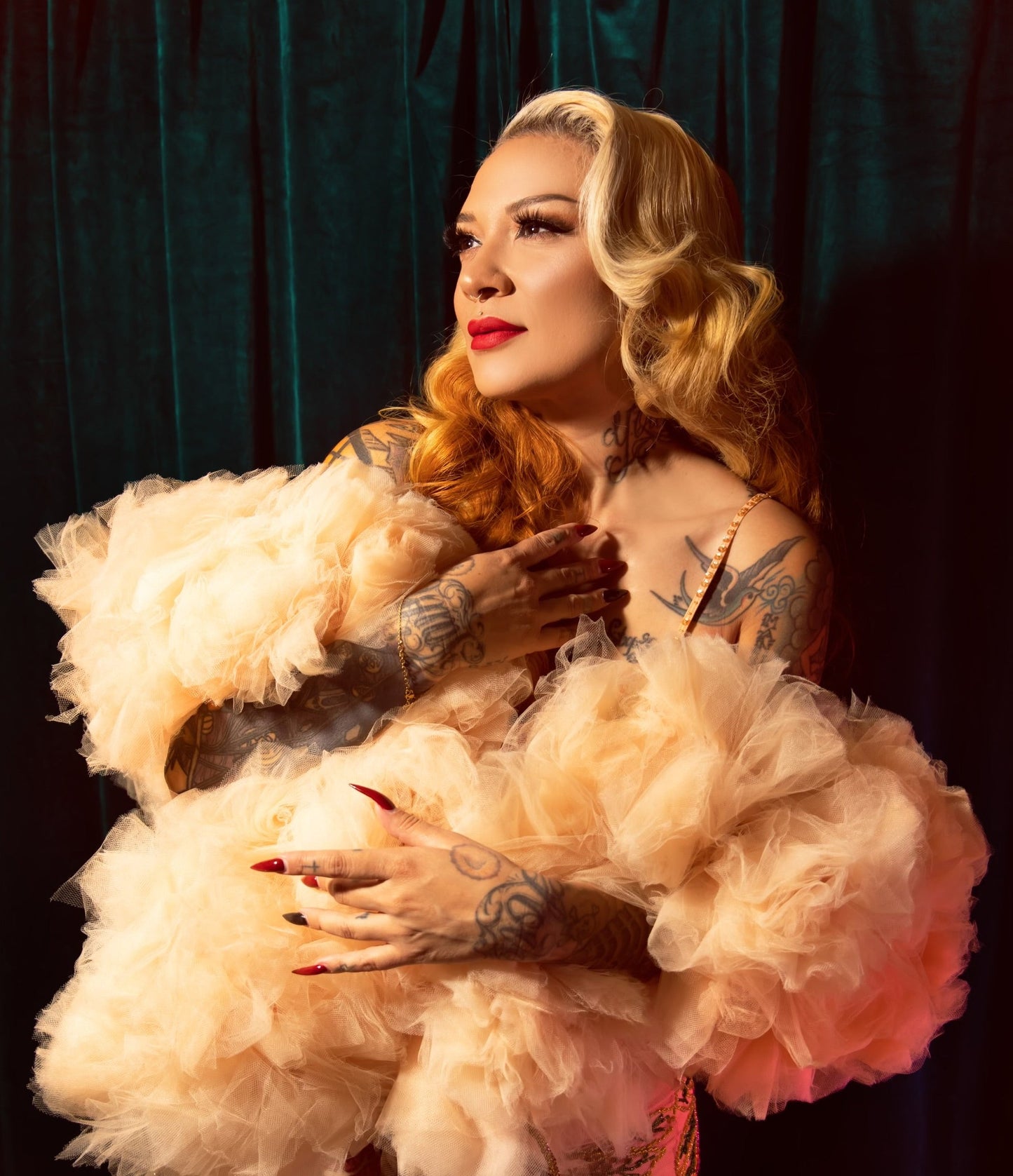 Rockwell De'Vil wrapped in a Champagne tulle boa - viva la bombshell burlesque innovation and handmade glamour