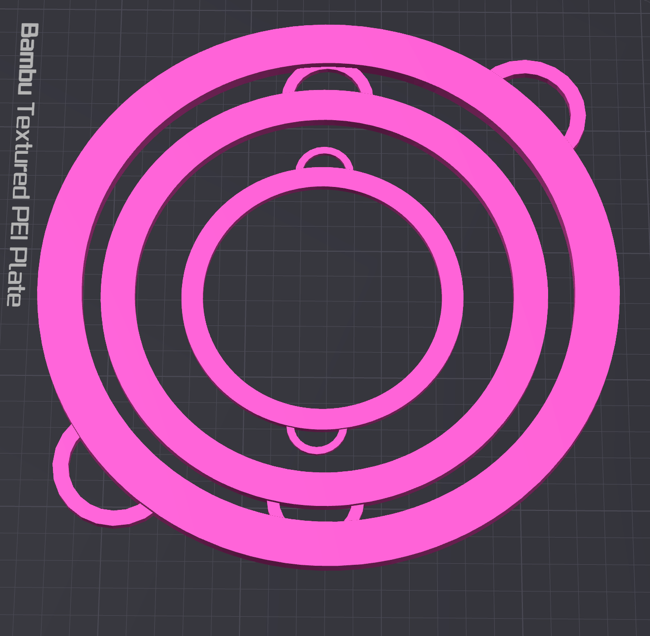 A 3D model of three concentric pink rings with oval tabs—ideal as a Circle Boa Bangle STL file (digital download) by Viva La Bombshell Burlesque—on a dark grid background. Text on the left reads Bambu Textured PEI Plate.