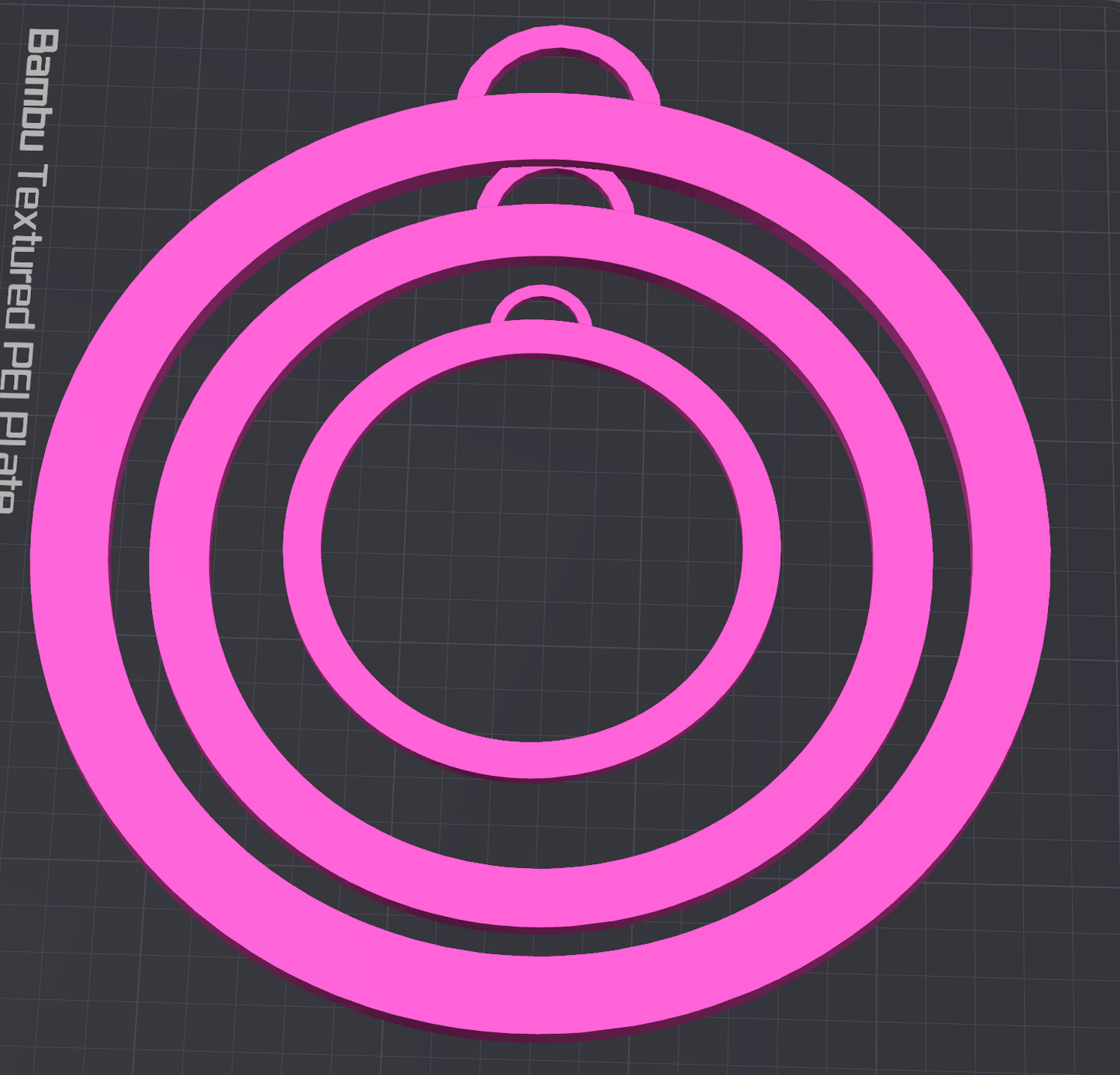 The Circle Boa Bangle STL File by Viva La Bombshell Burlesque features four concentric pink rings with tabs, arranged on a dark grid. This 3D printable digital download is perfect for use with Bambu Textured PEI Plate.